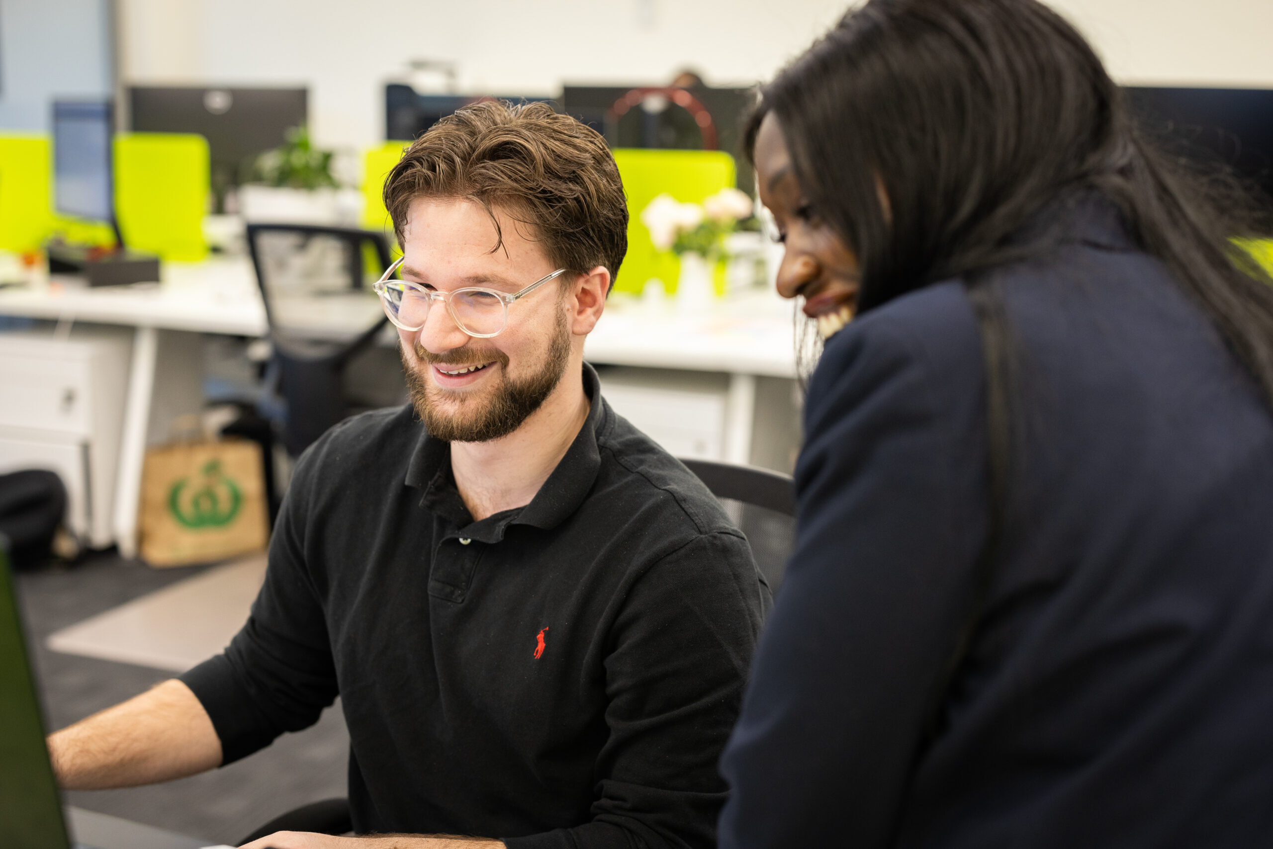 Two IGNYT staff members discussing your winning SEO strategy