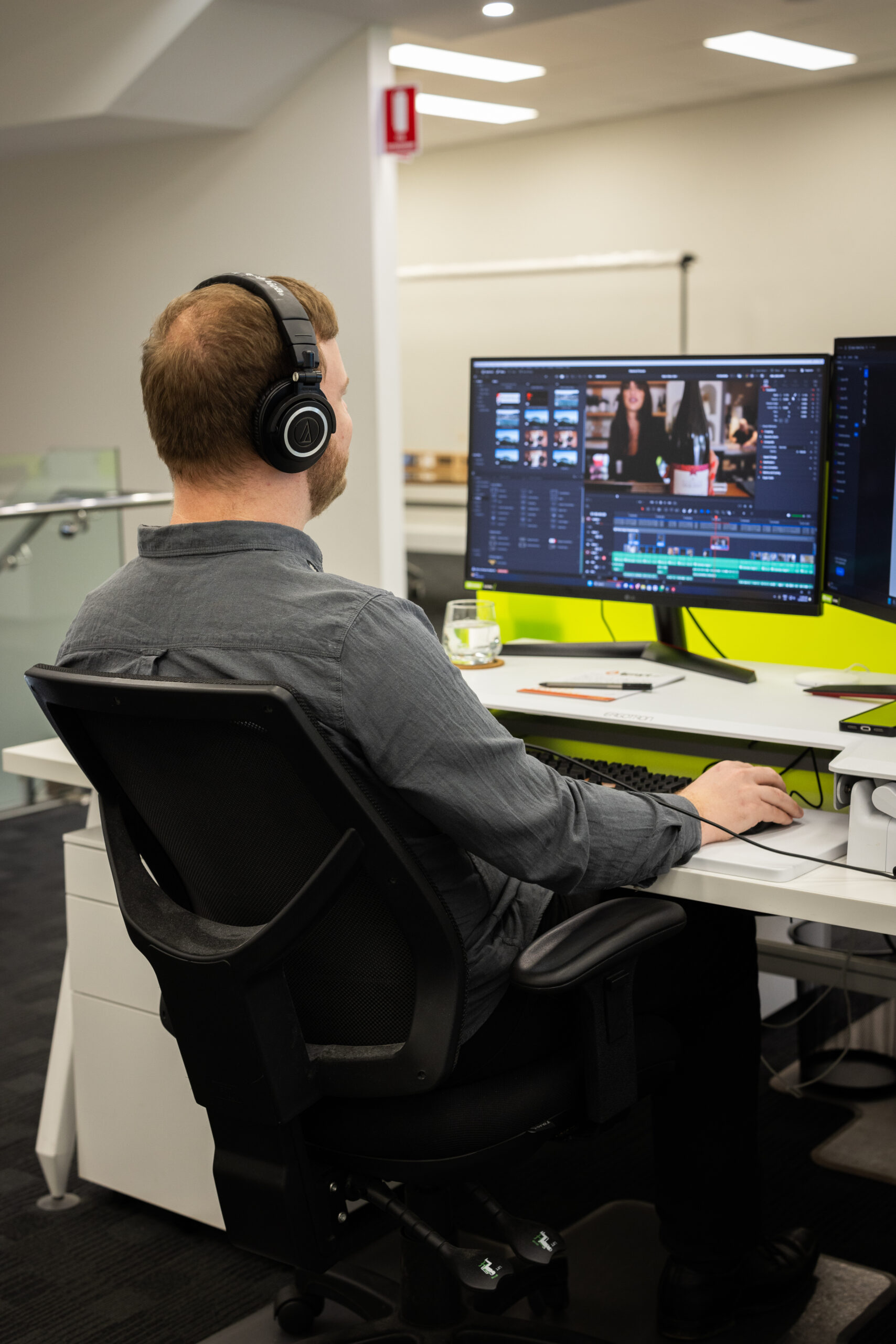 IGNYT team member editing a high-impact retail video that is part of your pathway to success